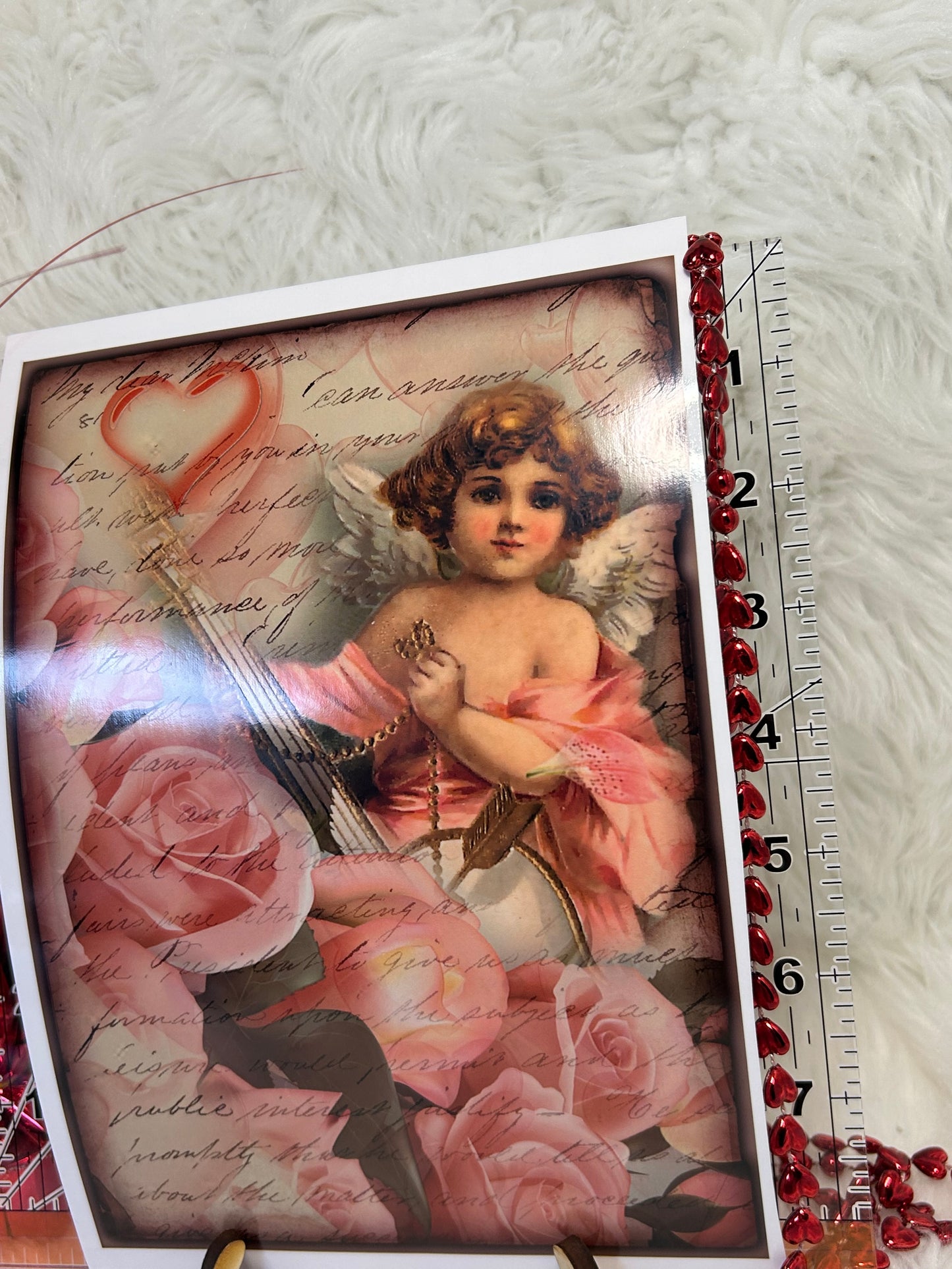 Vintage Cupid with roses